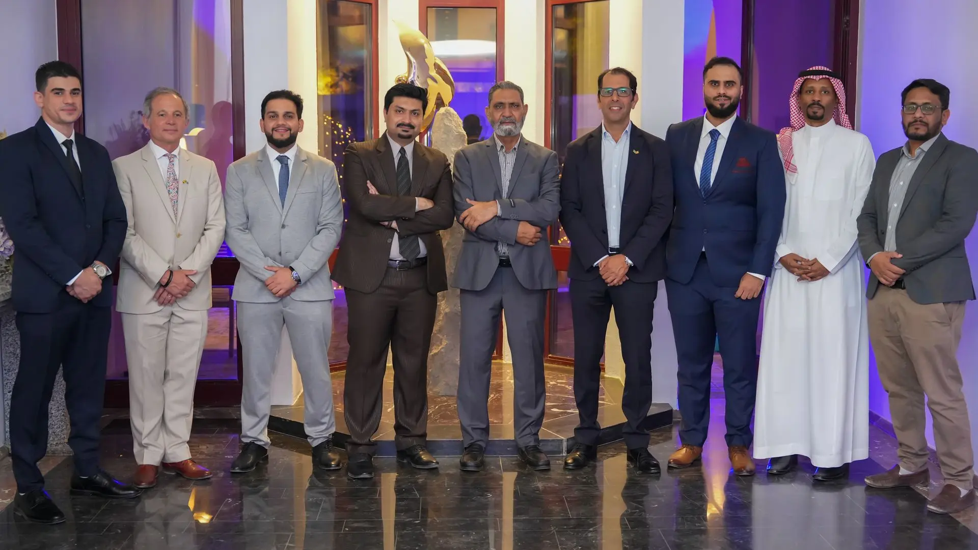 Group photo of Eezee team at a conference in Saudi Arabia