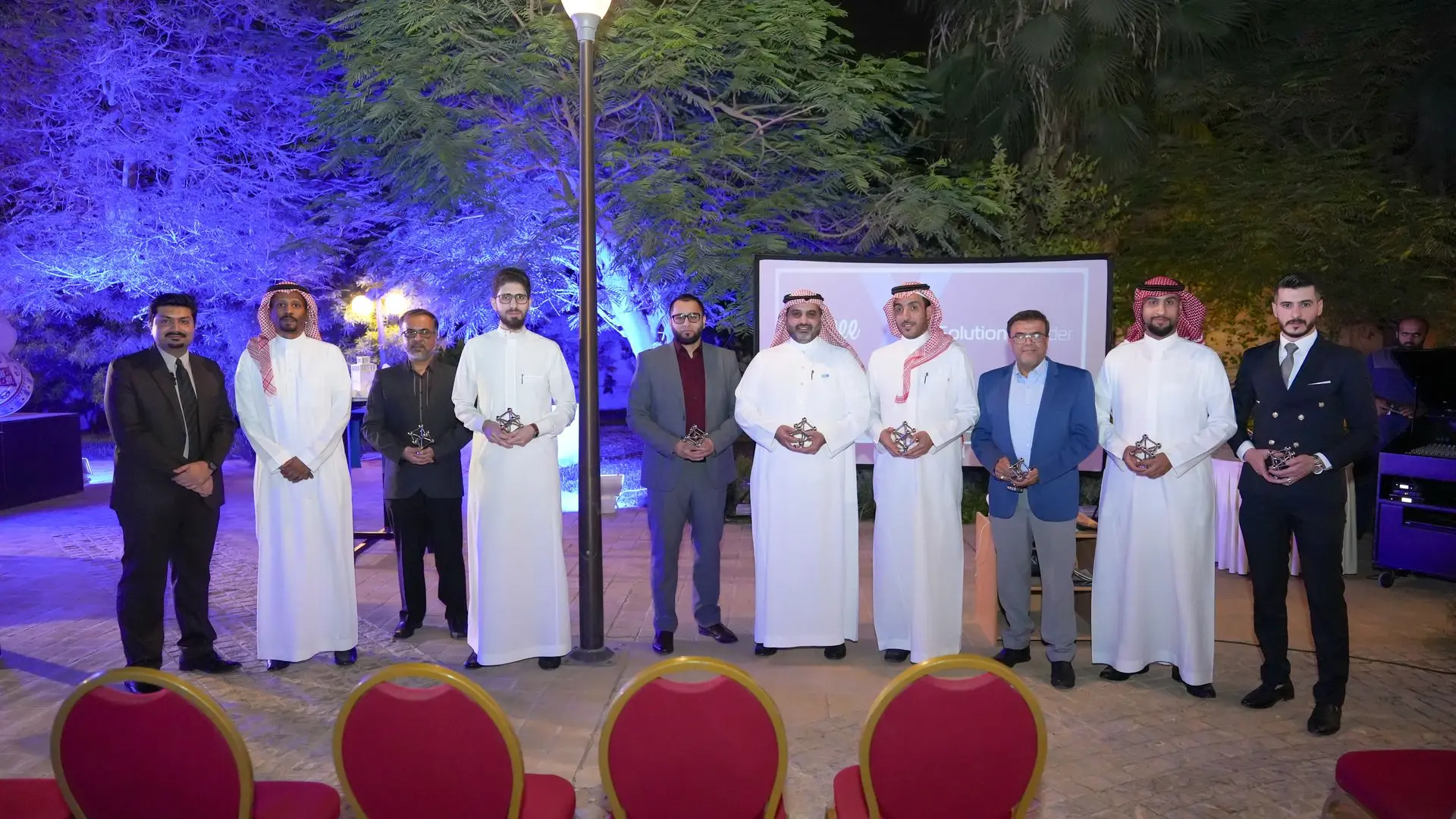 Group photo of Eezee team at a conference in Saudi Arabia