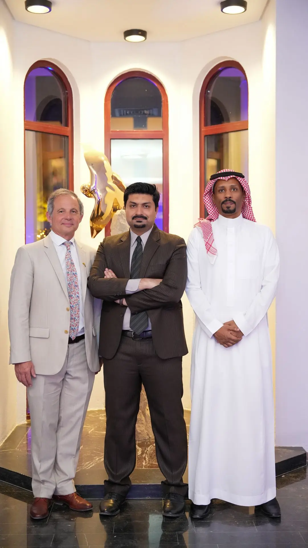 Group photo of Eezee team at a conference in Saudi Arabia