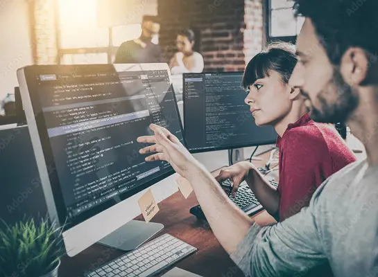 Team working on Odoo custom development and reviewing module code