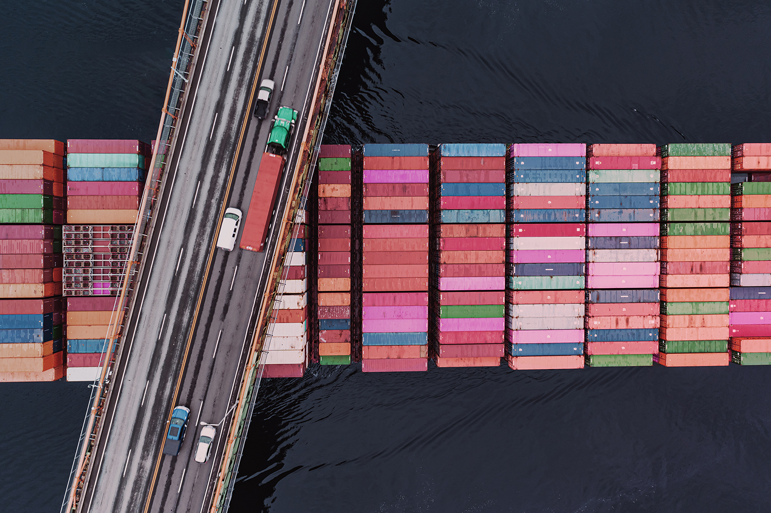 Aerial view of a cargo ship representing global transport operations.